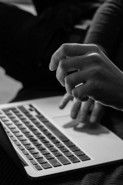 Photo by Sergey Zolkin grayscale photo of person using MacBook